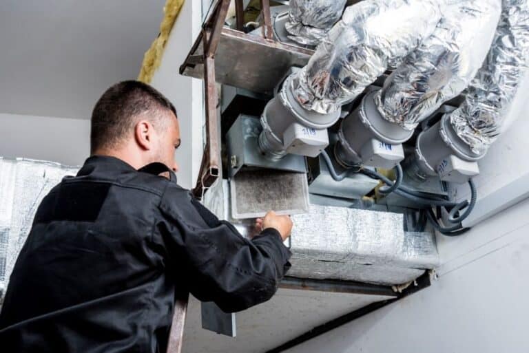 HVAC Technician Performing Maintenance on a Furnace