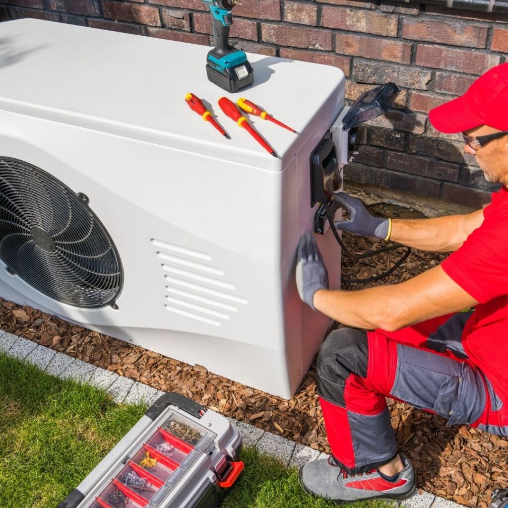 Close-up of an HVAC technician repairing an air conditioning unit in a Gilbert, Arizona home. AC Repair