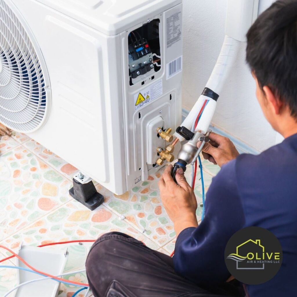 AC technician cleaning condenser coils in Gilbert, AZ