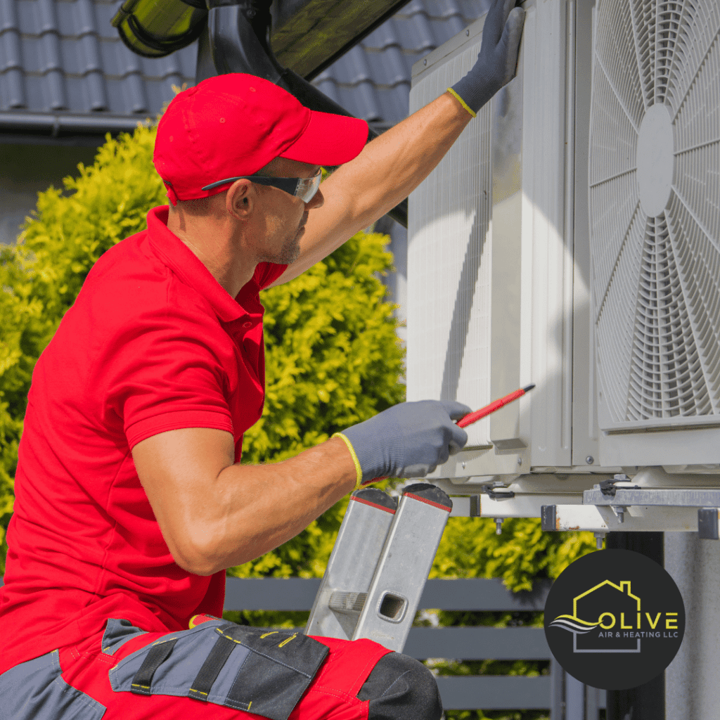 Olive Air and Heating LLC technician repairing an AC unit in Gilbert, AZ, helping homeowners save on repair costs.