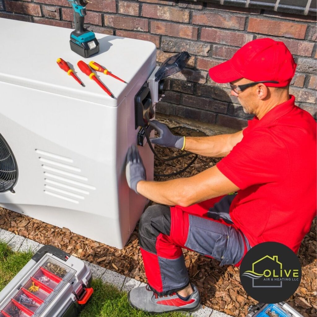 Technician wearing gloves while working on AC wiring