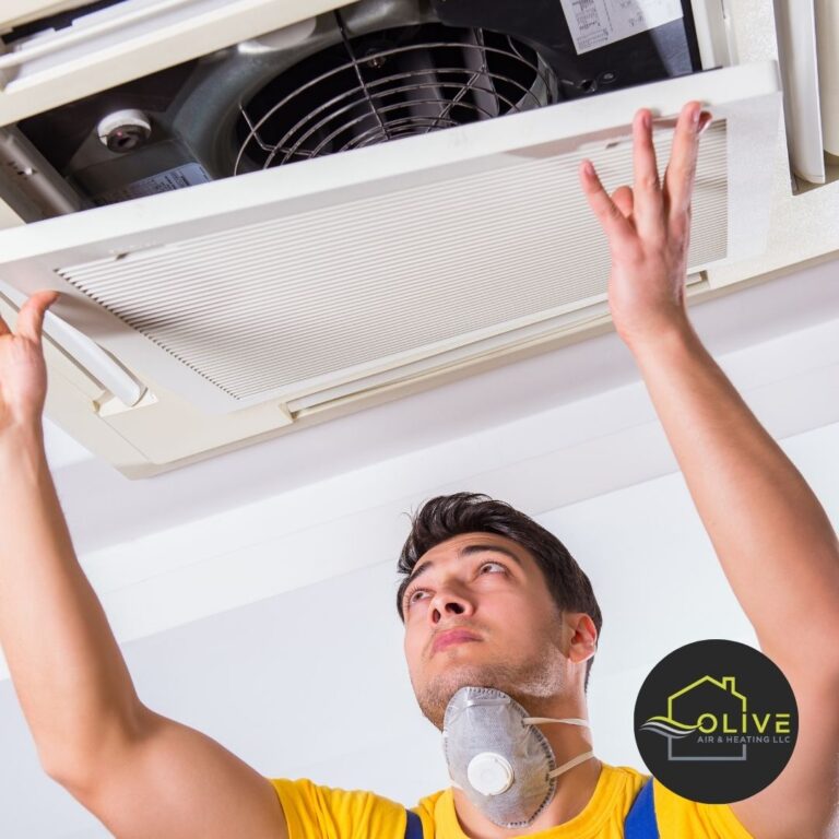 Technician installing an AC unit in Gilbert