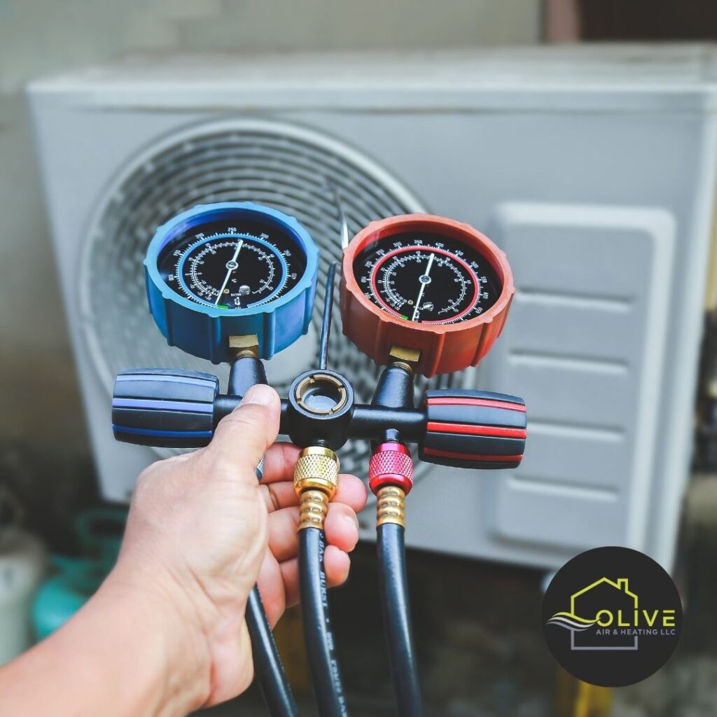 Close-up of an air conditioning unit receiving maintenance during an AC Tune-Up in Gilbert, AZ, with a technician's tools visible.