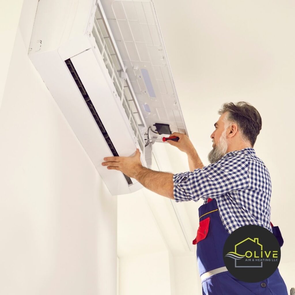 Technician carefully installing an AC unit in Tempe