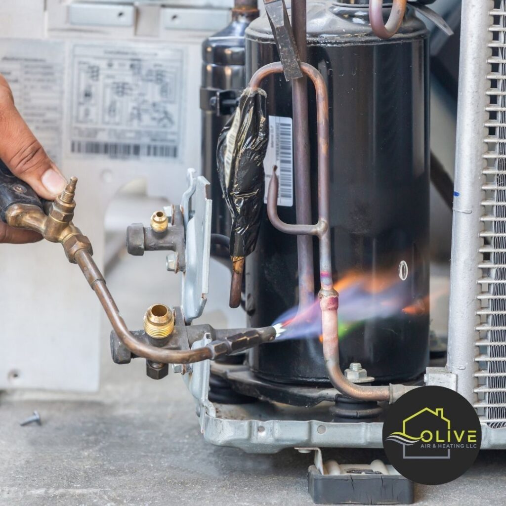 A certified HVAC technician performing an AC Tune-Up in Tempe, checking an air conditioning unit's components.