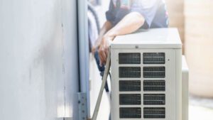 Olive Air Technician Performing a HVAC Installation