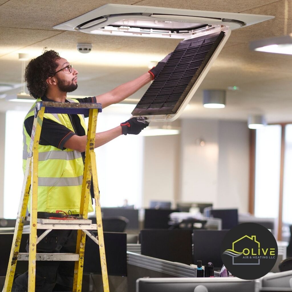 Technician fixing an AC unit in a residential home