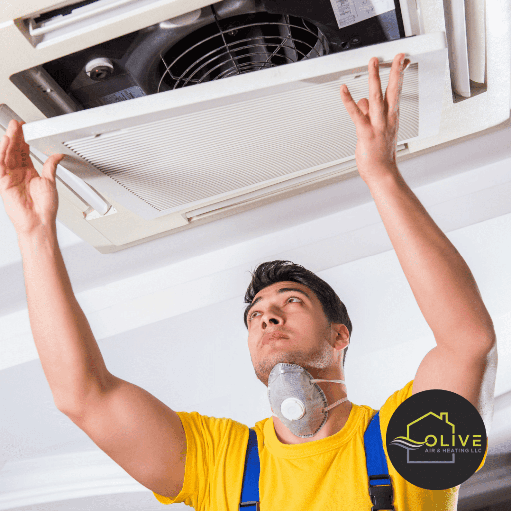 Technician inspecting an AC unit for water leaks in Gilbert, AZ, to diagnose the cause of the issue and determine the appropriate repair.