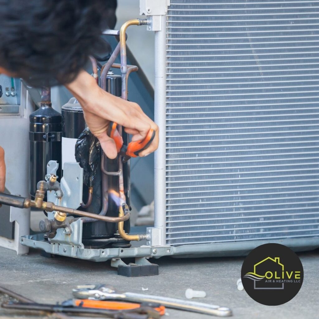 Homeowner inspecting AC unit for repair in Tempe summer