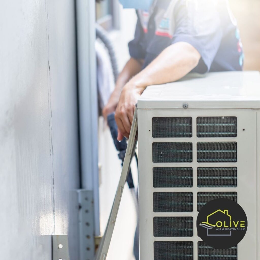 Technician performing an AC and Heating Tune-up