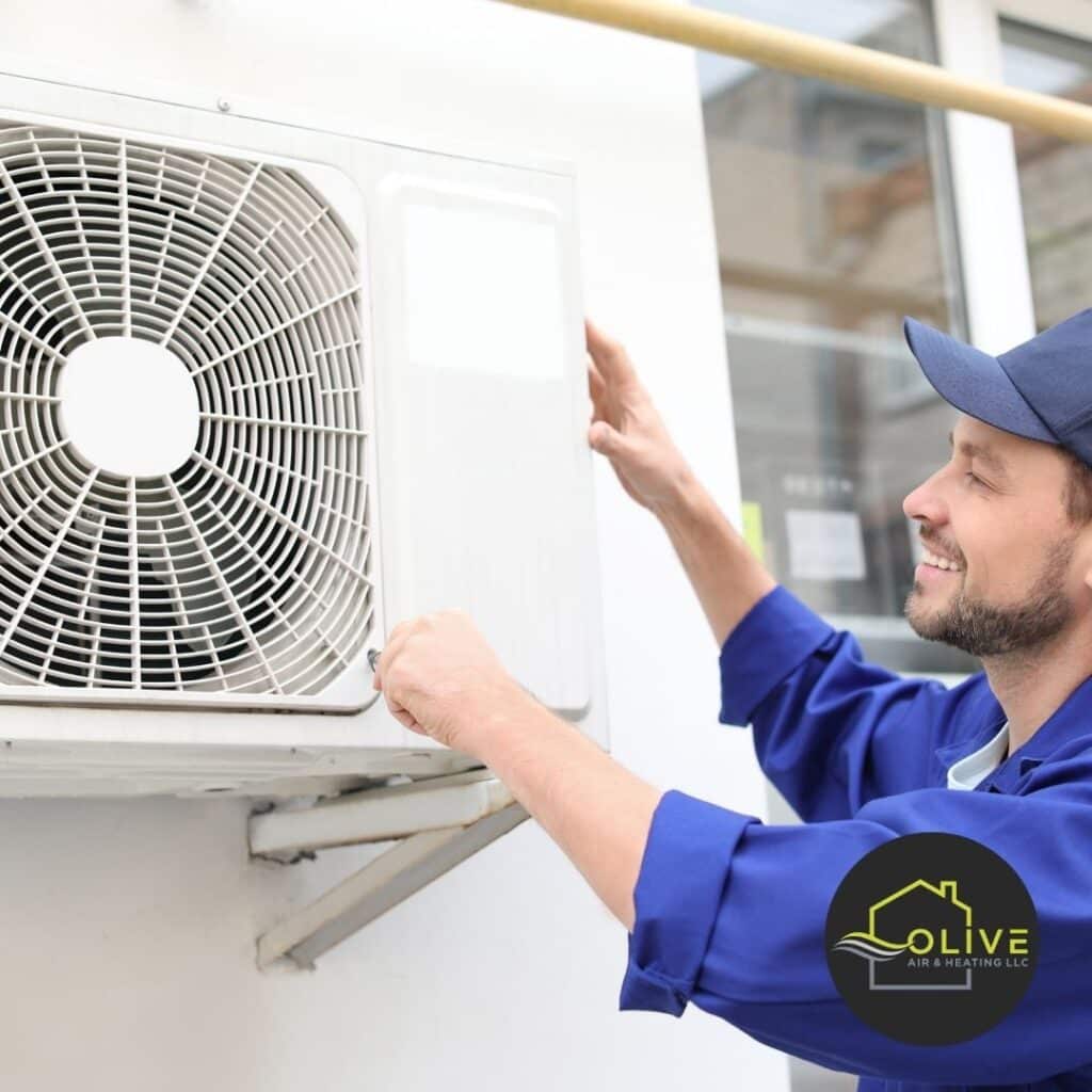 Technician performing AC Tune-ups in Tempe AZ to prevent costly repairs