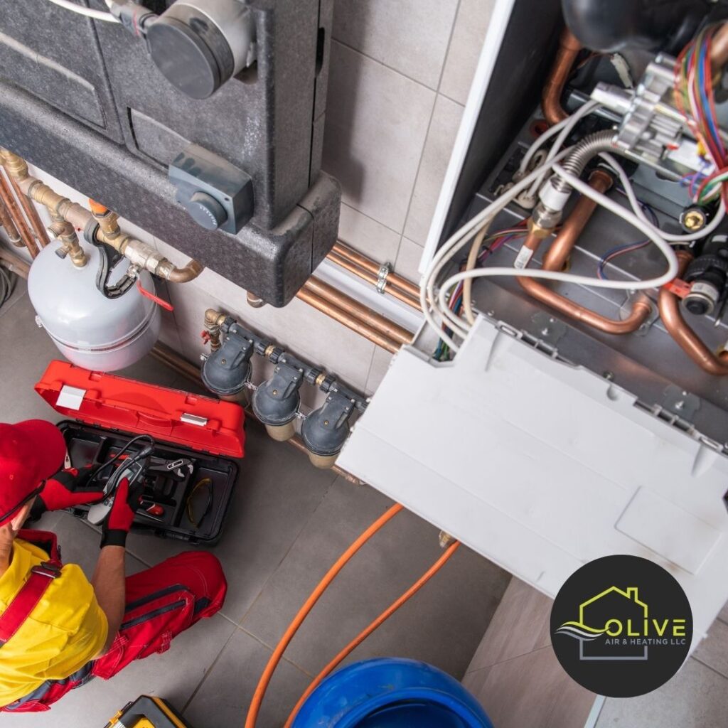 Technician performing an AC Tune Up Tempe to prevent summer breakdowns