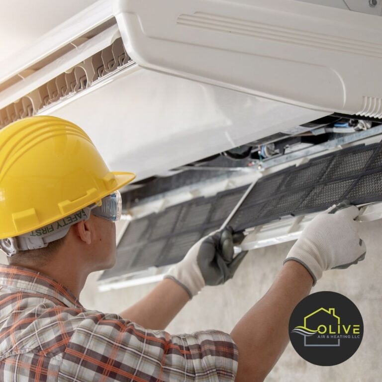 Technician repairing an air conditioner in Gilbert AZ