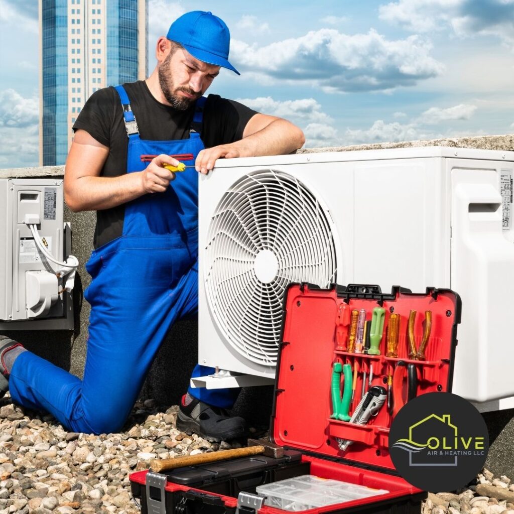 Technician repairing an air conditioner in Tempe AZ