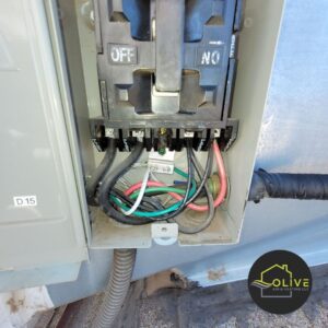 A close-up image of faulty electrical connections in an AC unit. Loose or damaged wires can lead to electrical shorts, fires, and system malfunctions. Regular AC maintenance can help identify and repair faulty wiring.