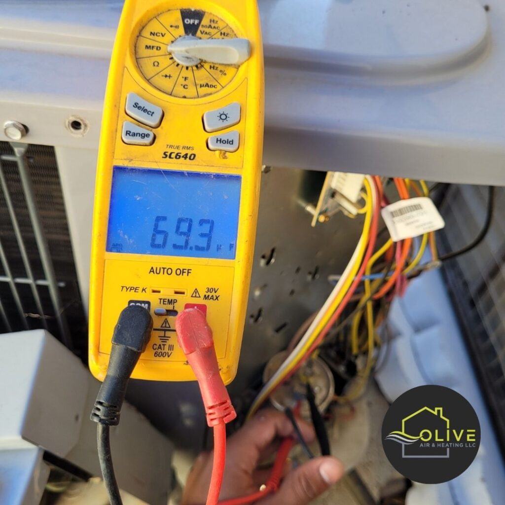 A technician using a digital multimeter to diagnose an air conditioning unit in Gilbert, Arizona, ensuring precise measurements and efficient repairs. AC Repair Gilbert