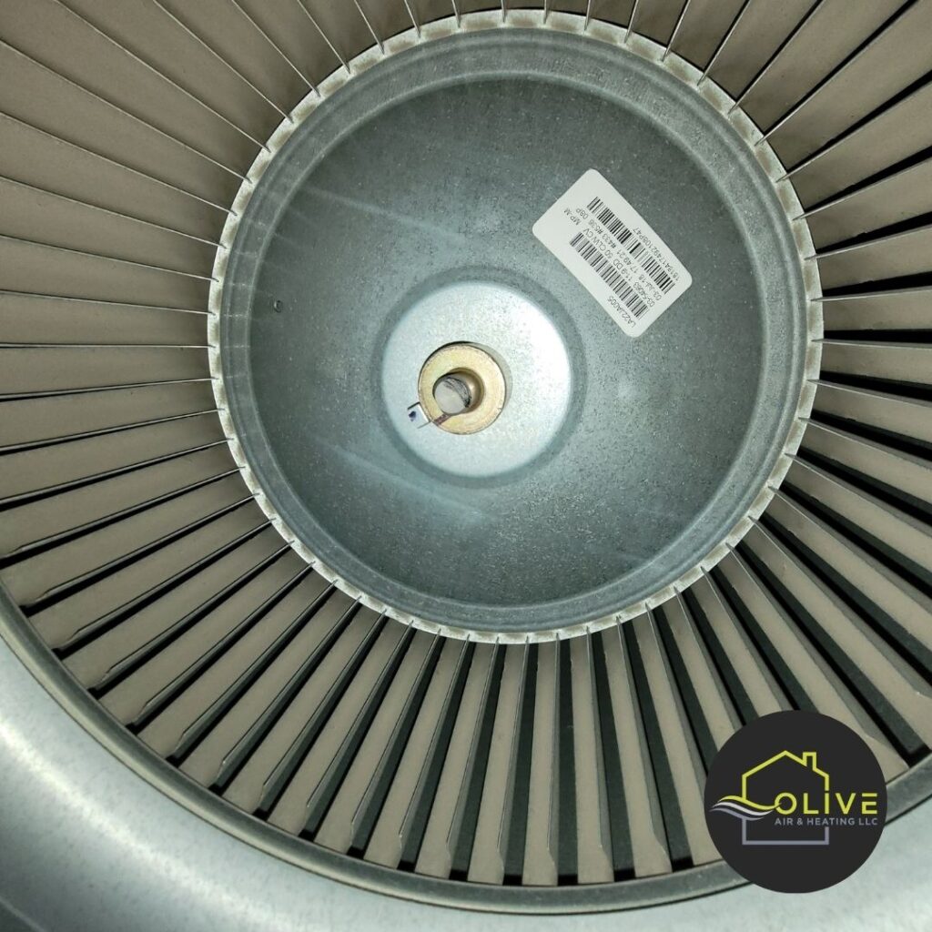 A close-up of a dirty and clogged blower wheel in a Gilbert home, emphasizing the importance of professional heating repair to restore efficient and reliable operation. Heating Repair Gilbert