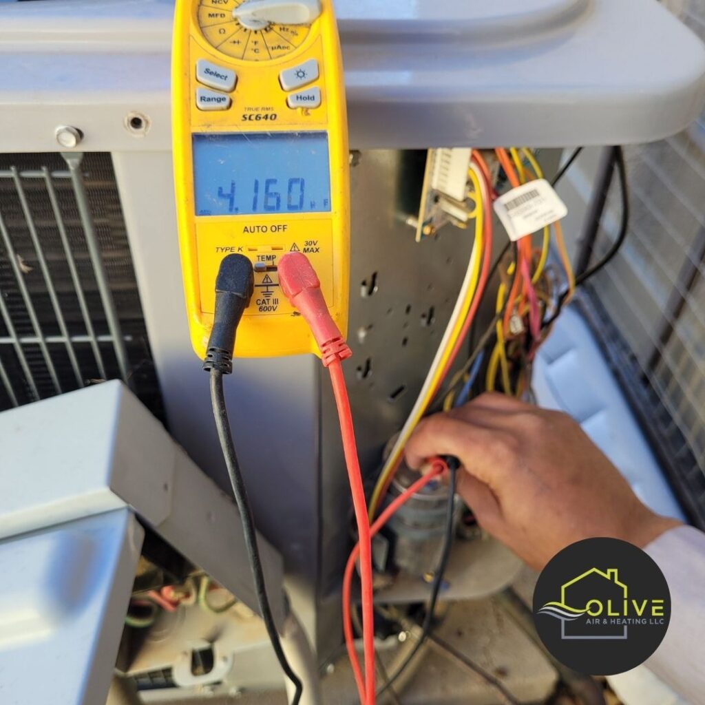 A technician using a digital multimeter to diagnose a heating system in Gilbert, Arizona - ensuring optimal performance and comfort for your home. Heating Repair Gilbert