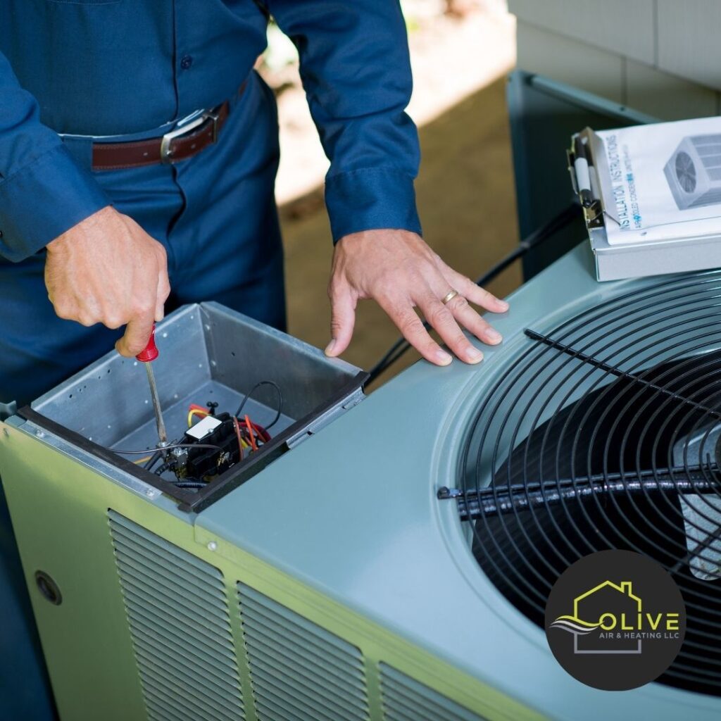 A technician carefully inspecting the electrical components of an outdoor AC and Heating Repair. Regular maintenance and inspections can help identify potential issues and prevent major breakdowns.