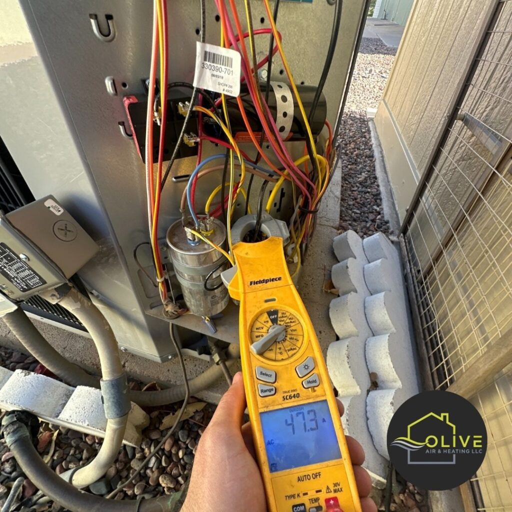 A technician using a multimeter to diagnose an aging air conditioning unit, highlighting the importance of considering an AC upgrade for older systems | AC Repair