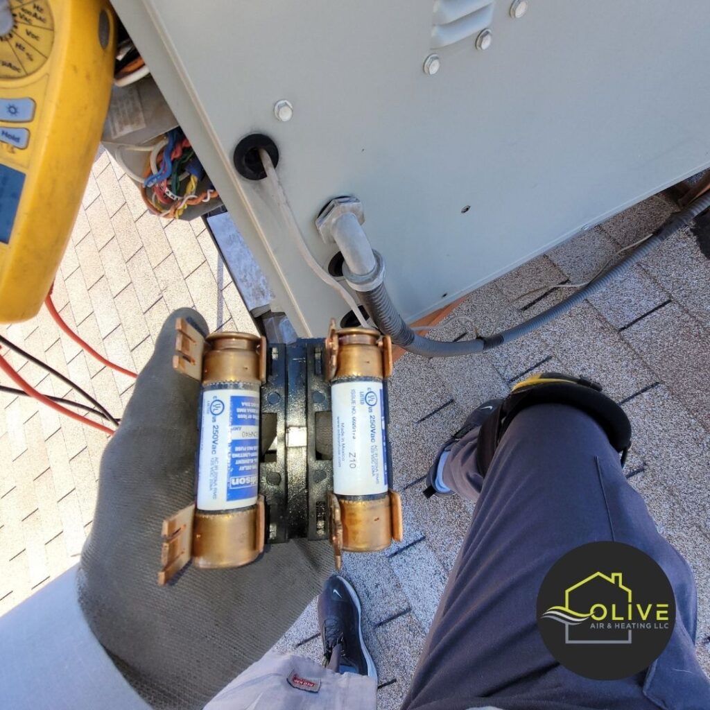 AC repair technician fixing a malfunctioning cooling unit to restore comfort during summer