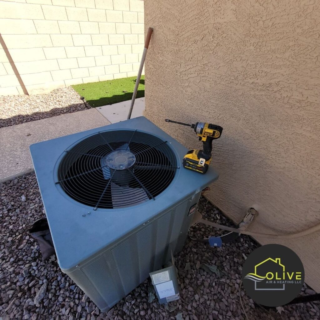 Professional AC repair technician fixing a residential air conditioning system