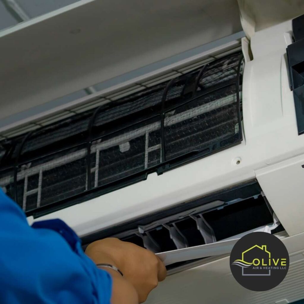 AC repair technician inspecting an air conditioning unit