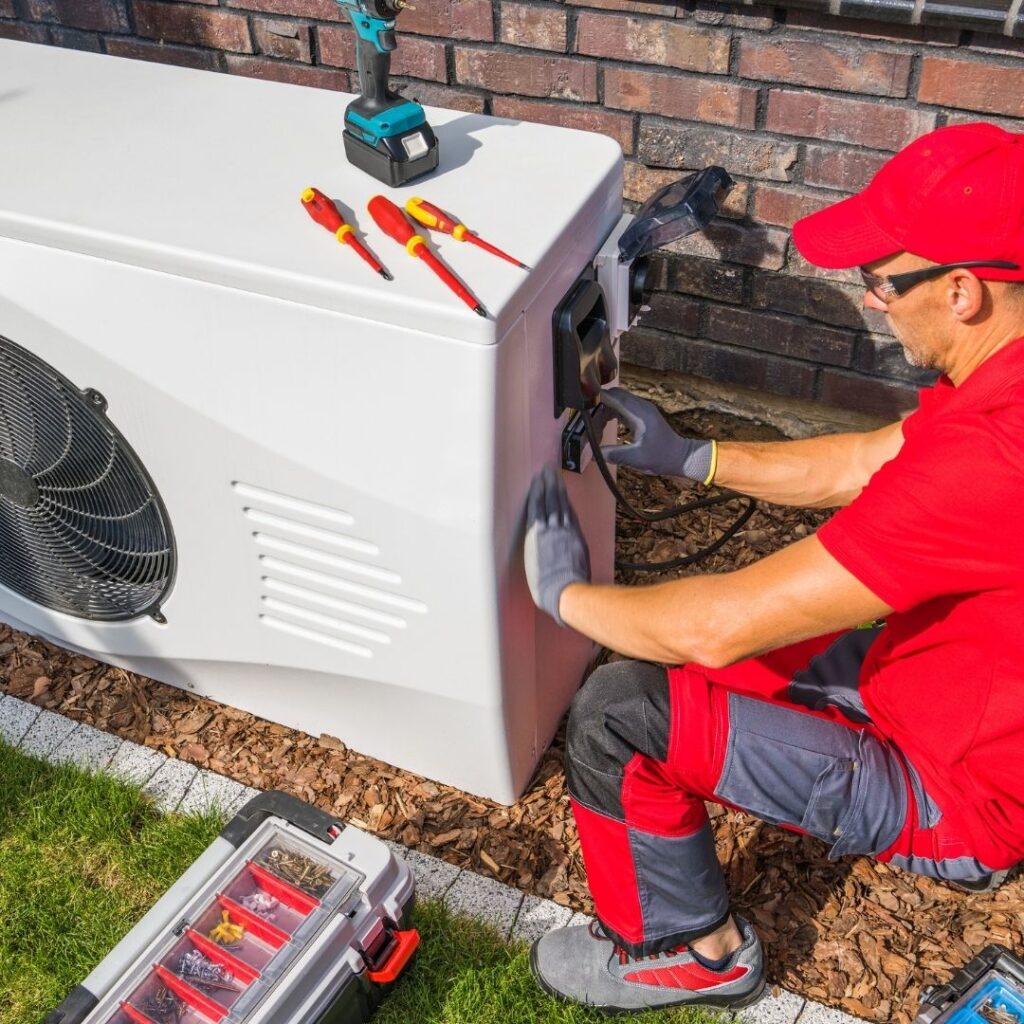 HVAC Technician Performing AC Maintenance on an Air Conditioner in Mesa, Arizona