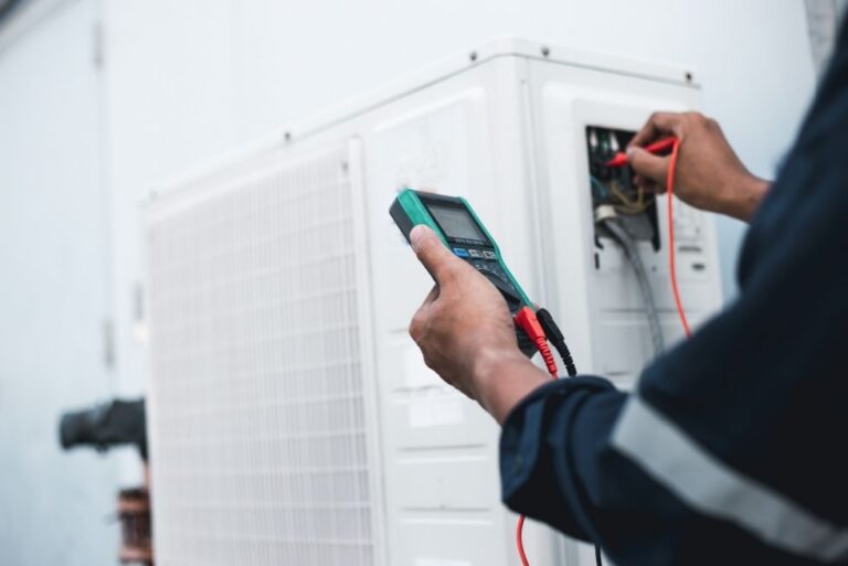 Skilled HVAC Technician Working on Air Conditioning Unit. Heating Repair