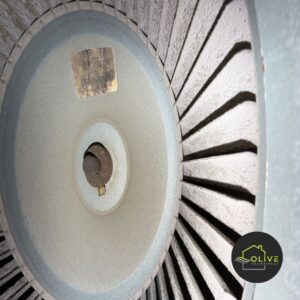 A close-up of a clean blower wheel, a key component within an HVAC system, emphasizing the importance of proper installation during HVAC Installation for efficient airflow.