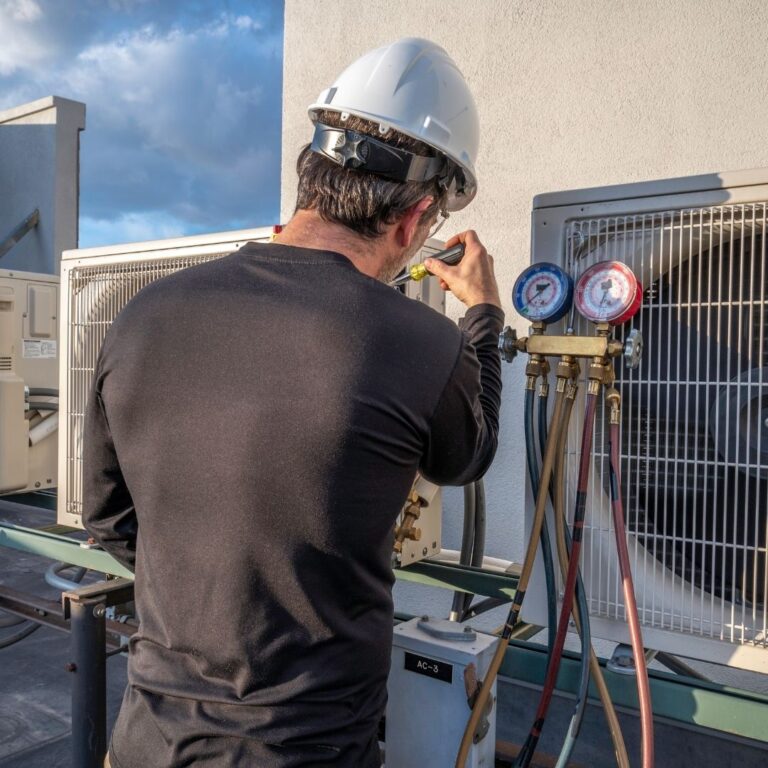 A technician inspecting a heating system component, emphasizing the importance of professional Heating Repair Services in Maricopa to maintain a warm and comfortable home.