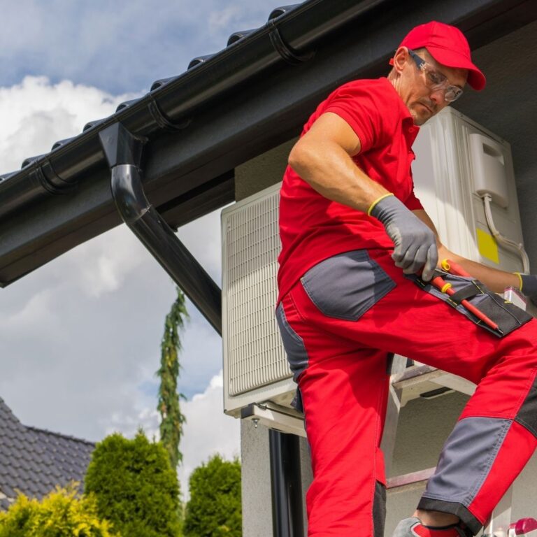 A technician inspecting a heating system component, emphasizing the importance of professional heating repair services in Sun Lakes to maintain a warm and comfortable home.